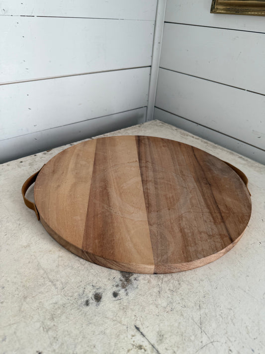 Round cutting board will be sanded and oiled