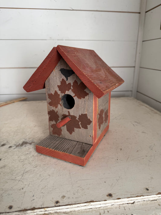 Small red bird house will get painted