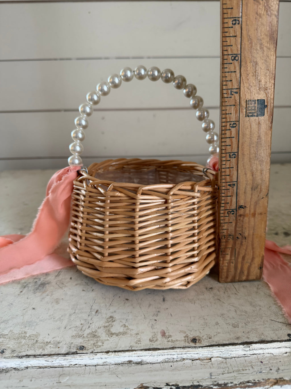 Flower girl basket with faux pearl handle with pink ribbon