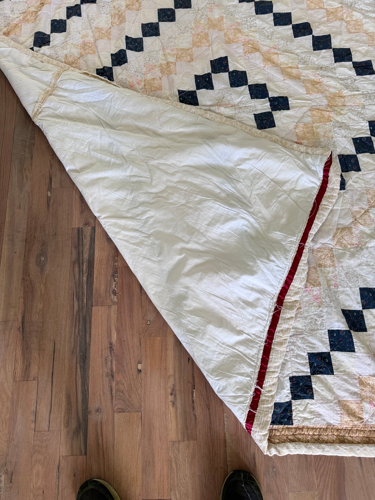 Hand made quilt with diamond pattern - has rips