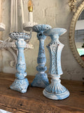 Set of three chippy French country candlesticks