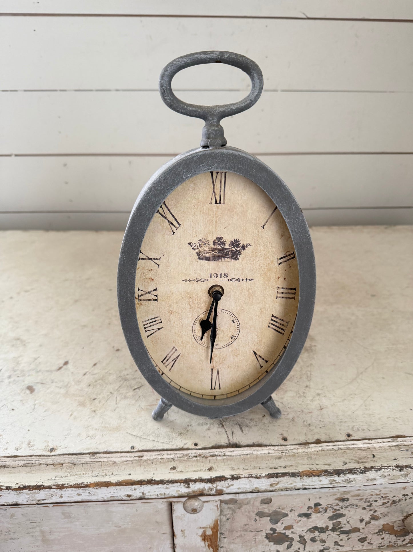 Gray standing oval clock will get makeover