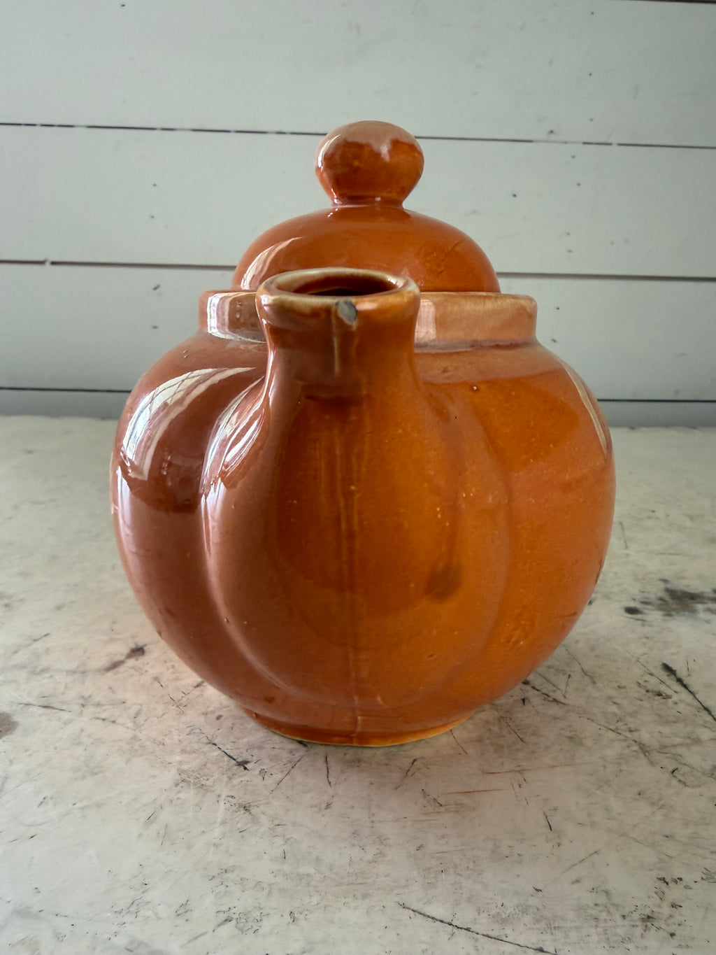 Ceramic orange glazed tea pot has some chip under lid - Madd in Japan