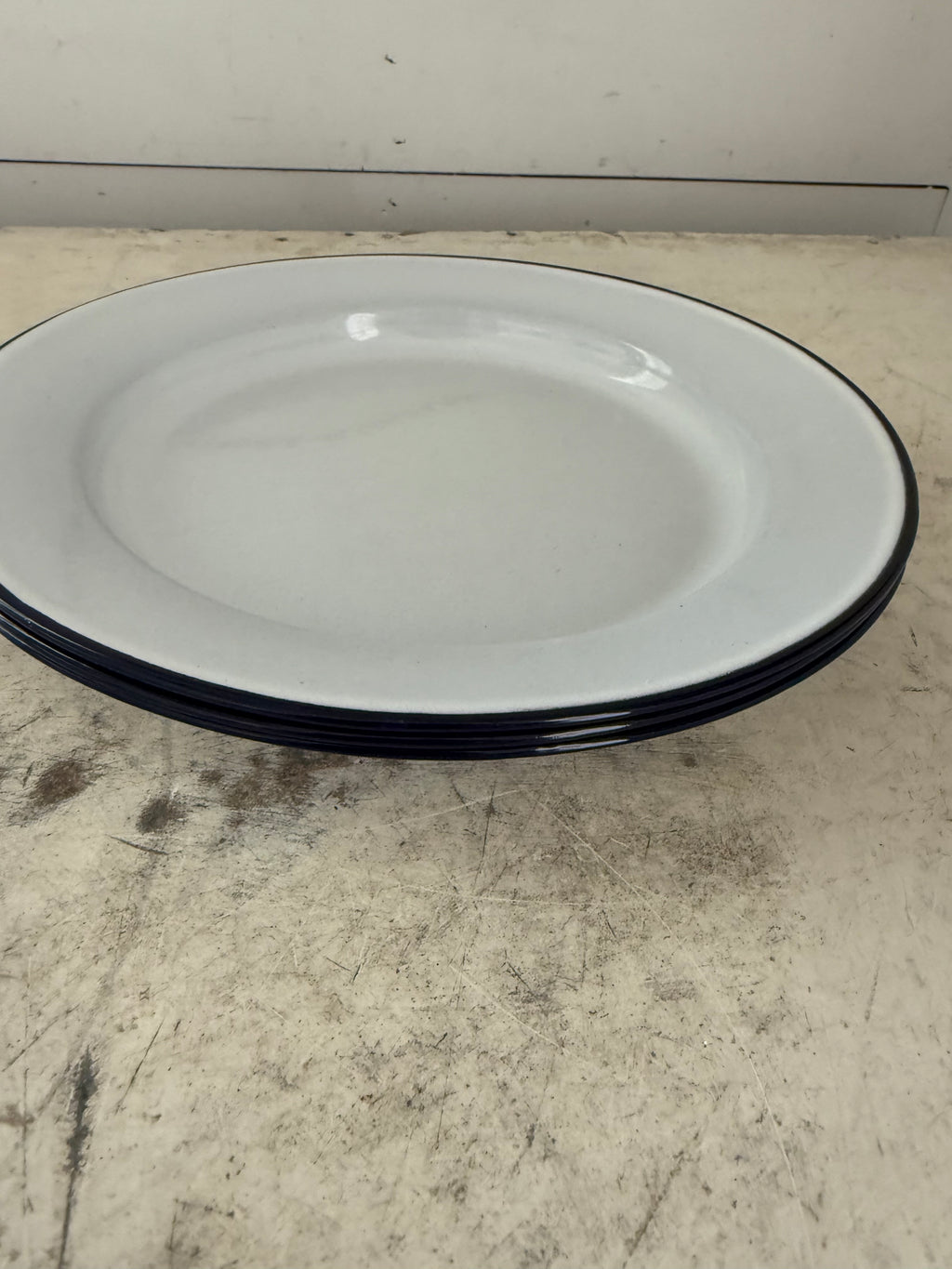 White enamel plate with navy edge sold individually