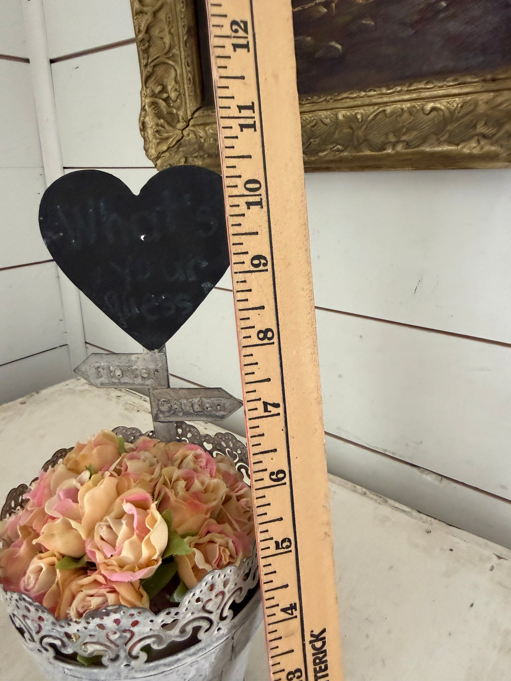 Rustic galvanized metal pot filled with artificial peach and pink roses, featuring a heart-shaped chalkboard sign- heart will get makeover