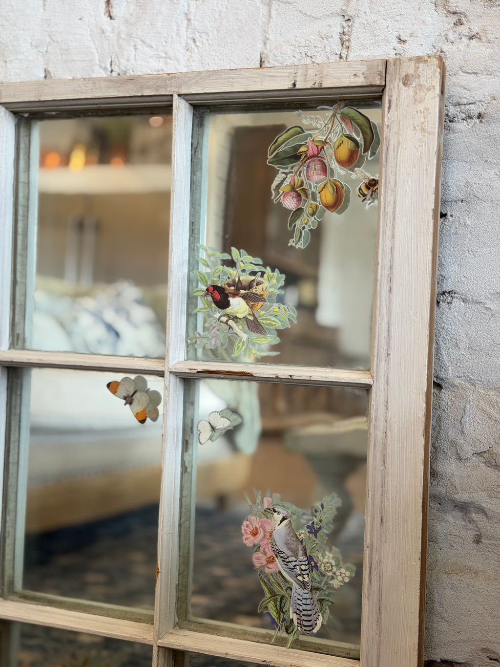 Window with old glass and mirror behind