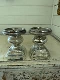 Set of mercury glass  finished candlestick holder features a traditional turned baluster design
