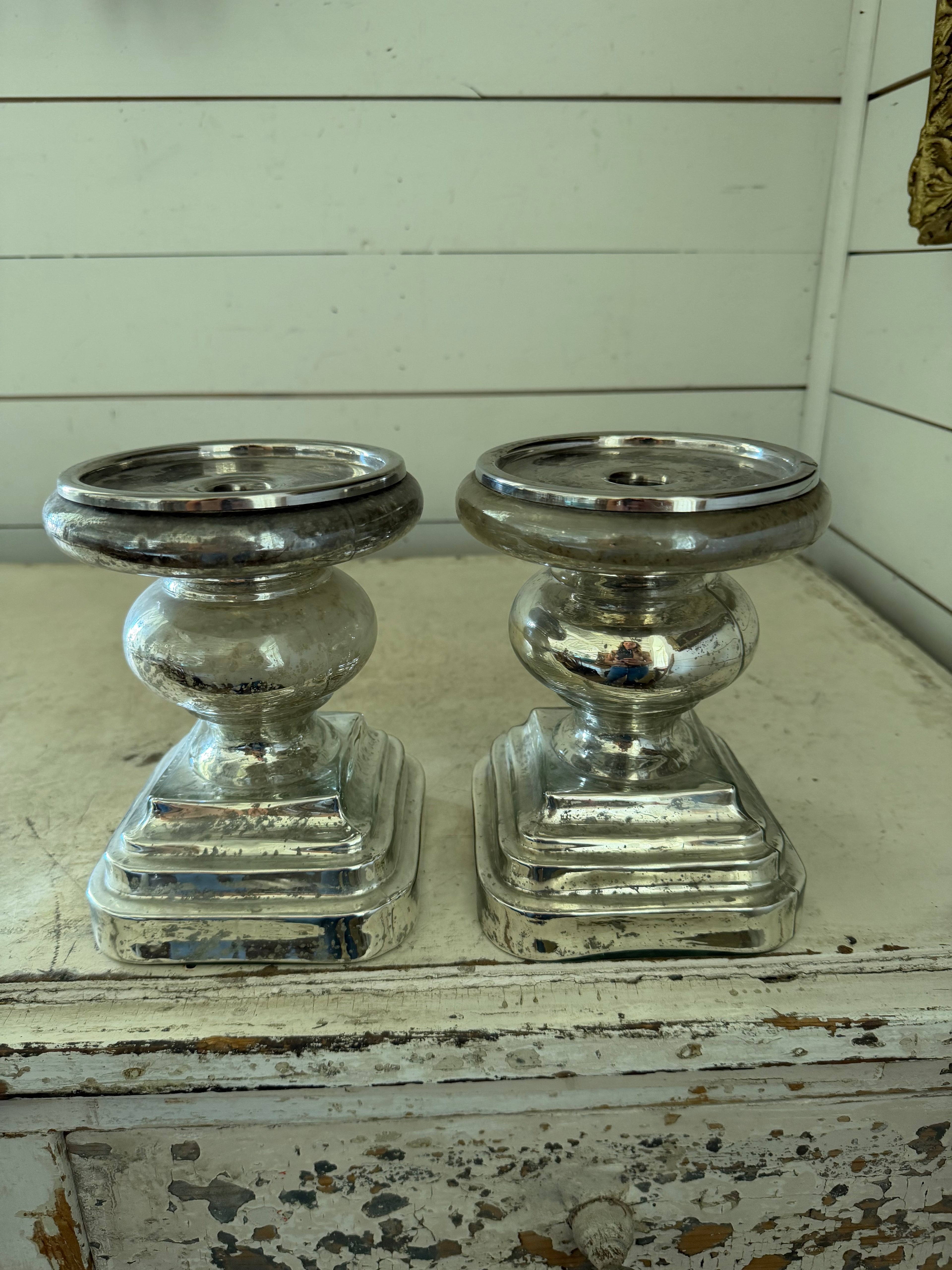 Set of mercury glass  finished candlestick holder features a traditional turned baluster design