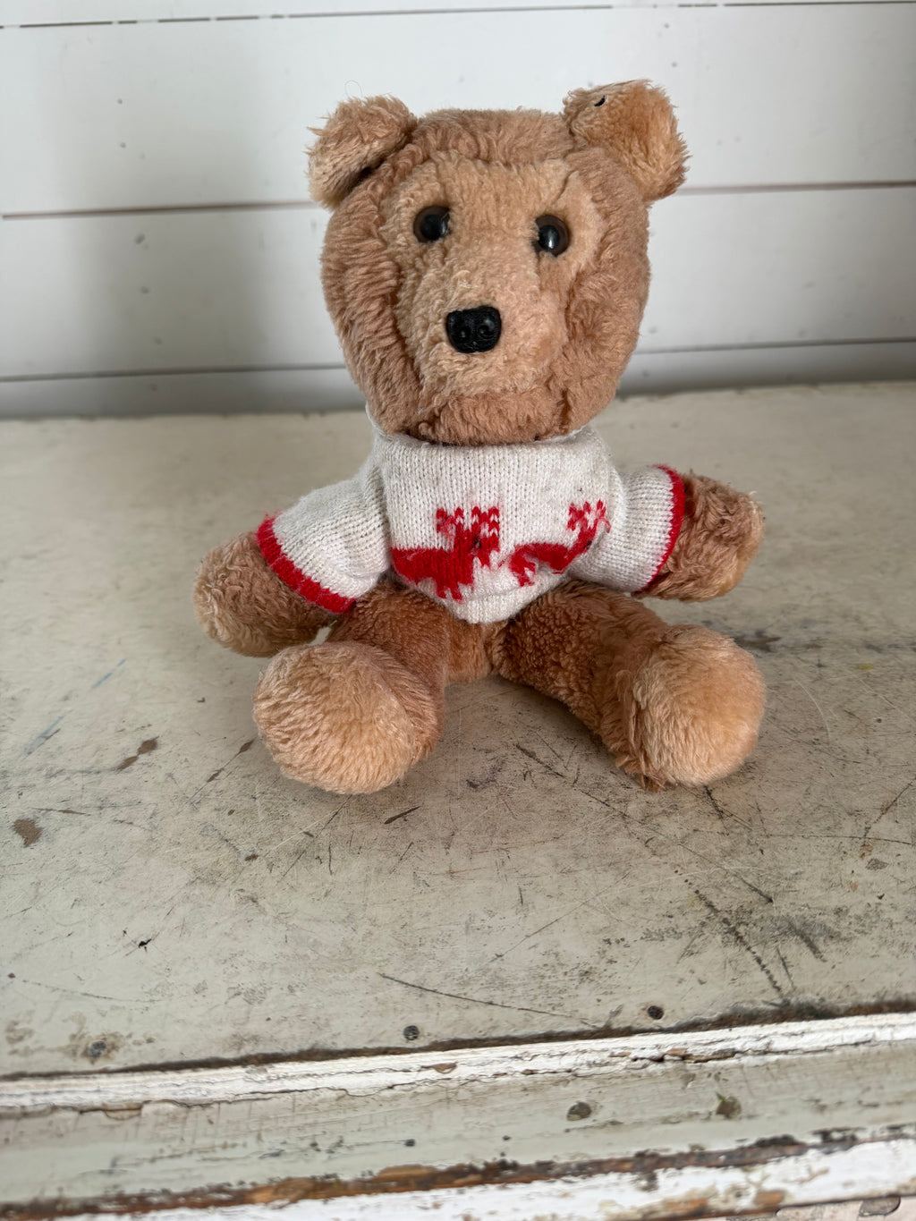 Vintage teddy bear with reindeer sweater