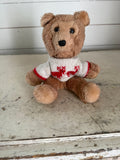 Vintage teddy bear with reindeer sweater