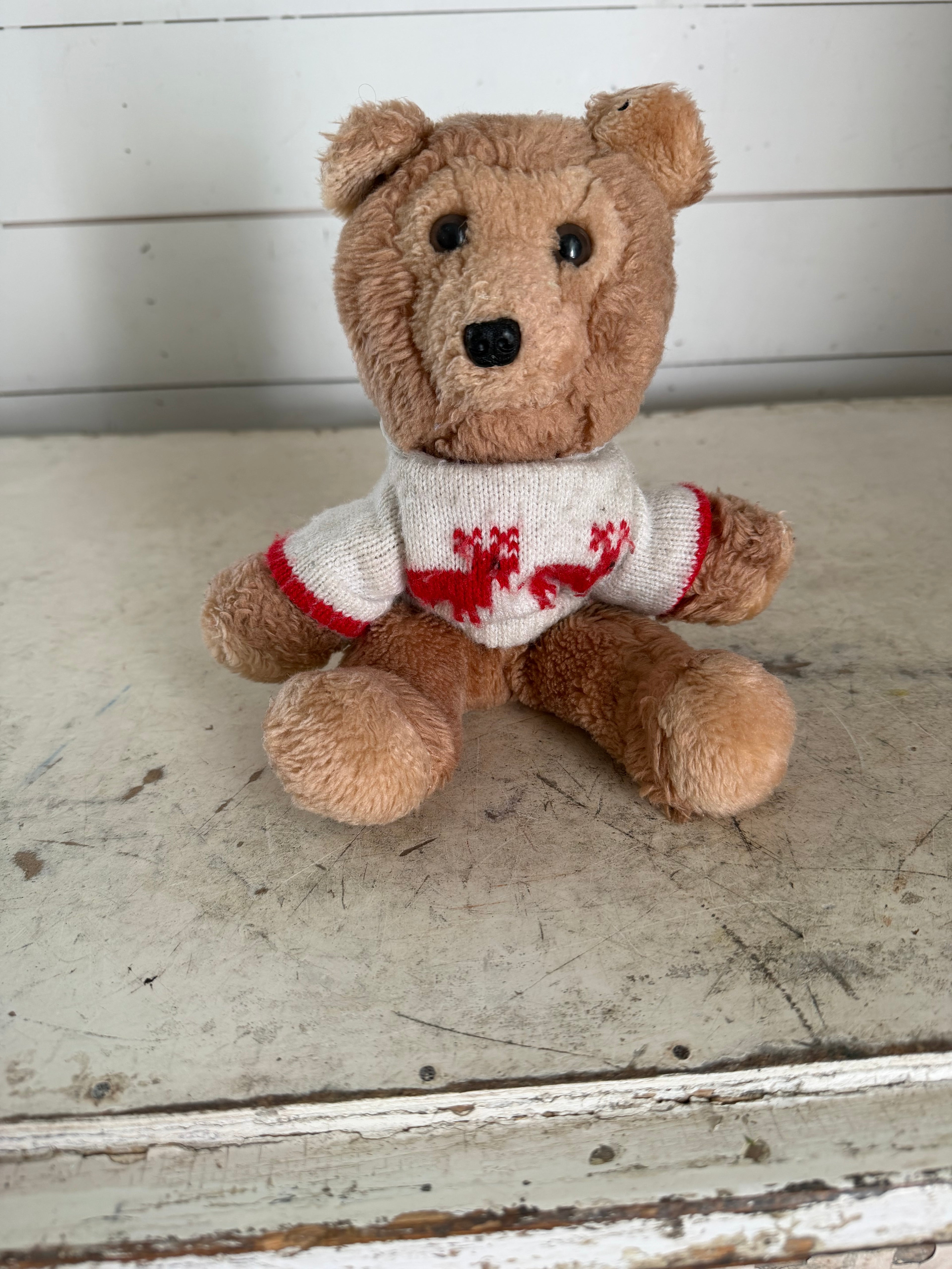 Vintage teddy bear with reindeer sweater