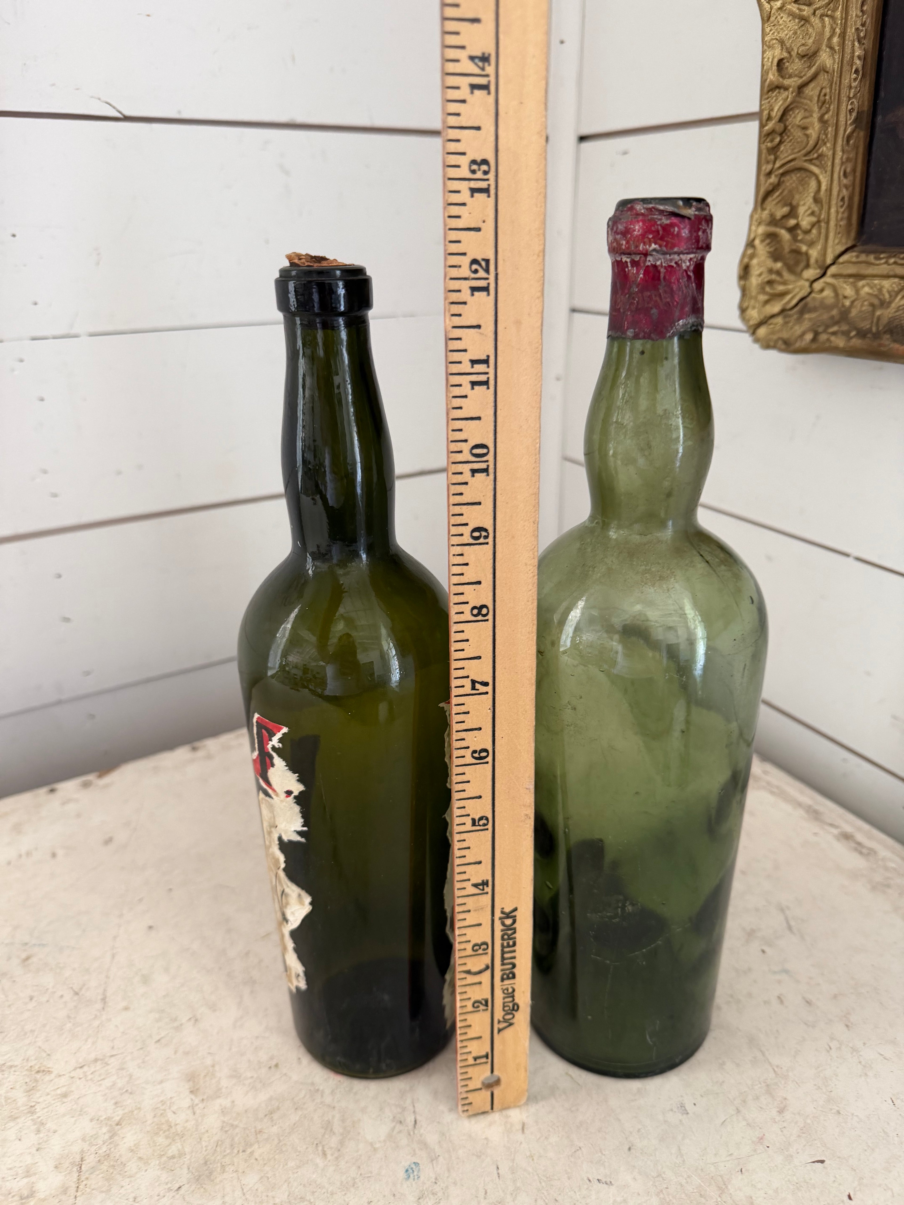 Pair of antique / vintage French style green bottles