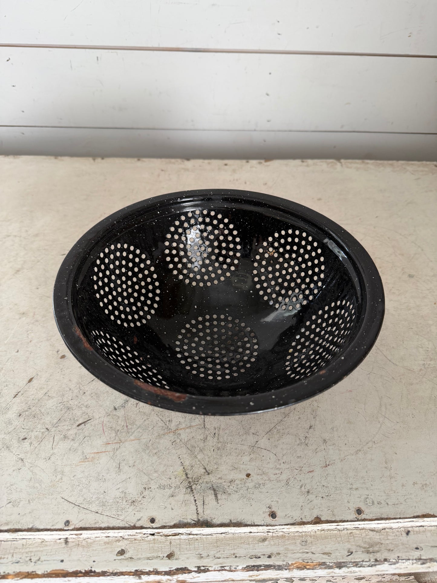 Vintage black speckled enamel colander - has some chips