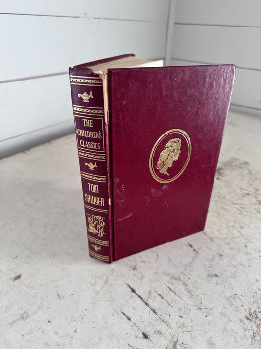 The Children’s Classics (Tom Sawyer) binding is damaged as pictured