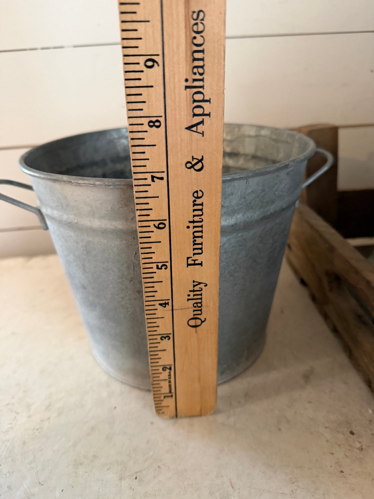 Galvanized bucket planter with holes