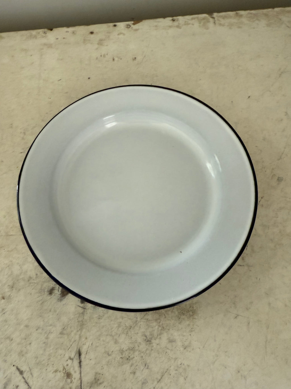 White enamel plate with navy edge sold individually