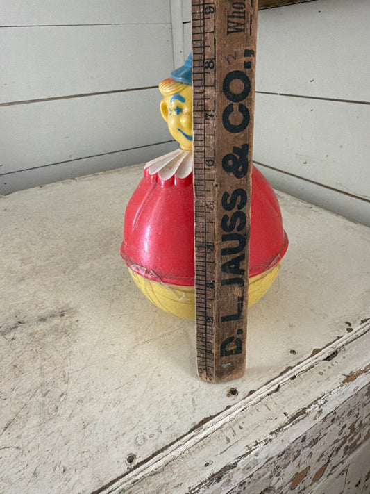 Vintage Roxy Poly Clown Toy has tape on it