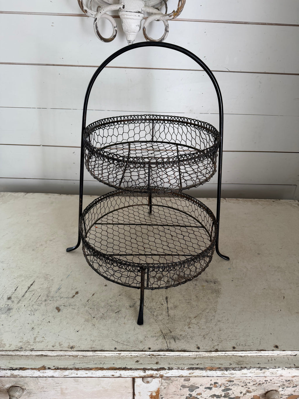Black 2-tier wire basket with rustic chicken-wire mesh