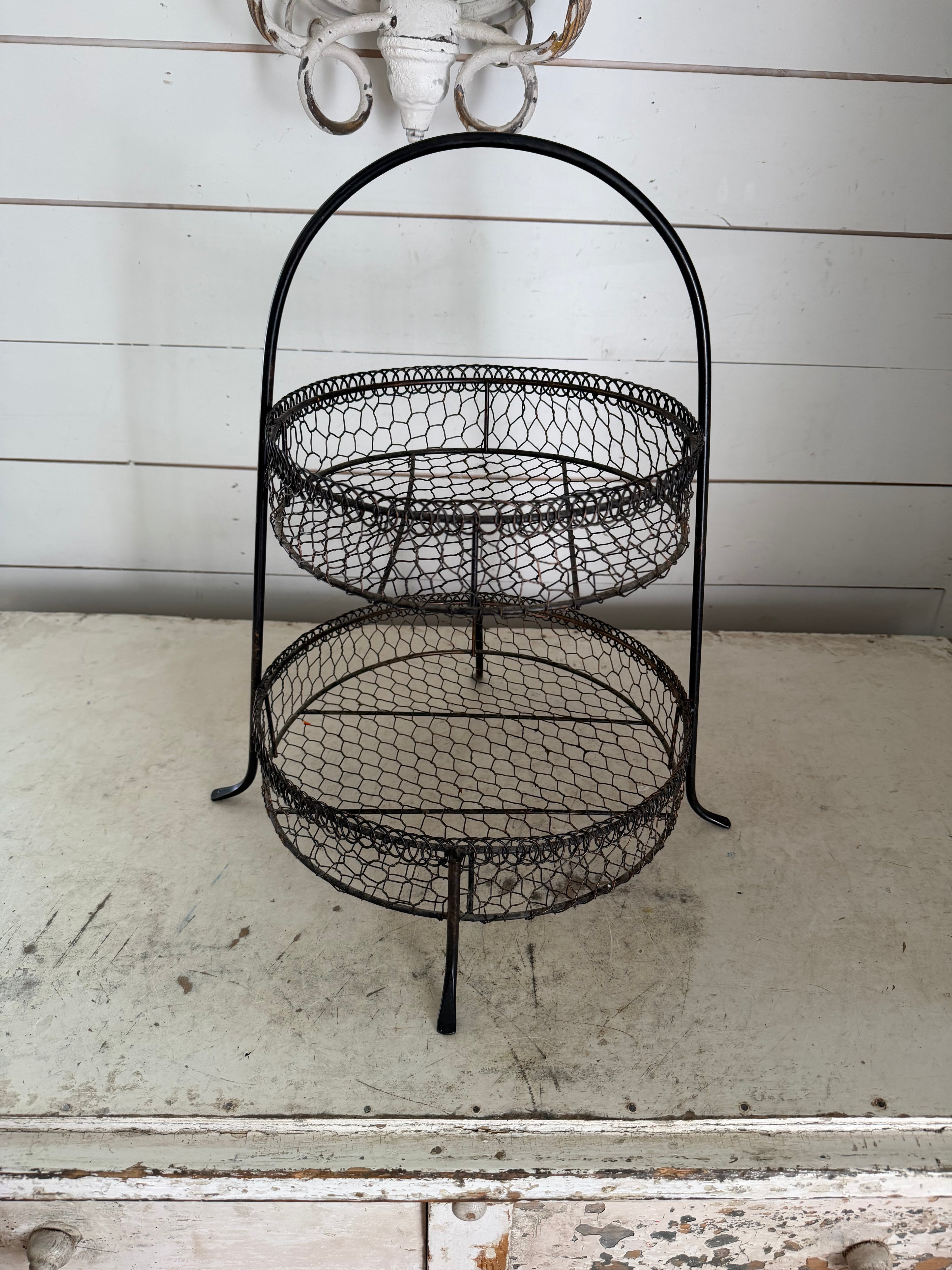 Black 2-tier wire basket with rustic chicken-wire mesh