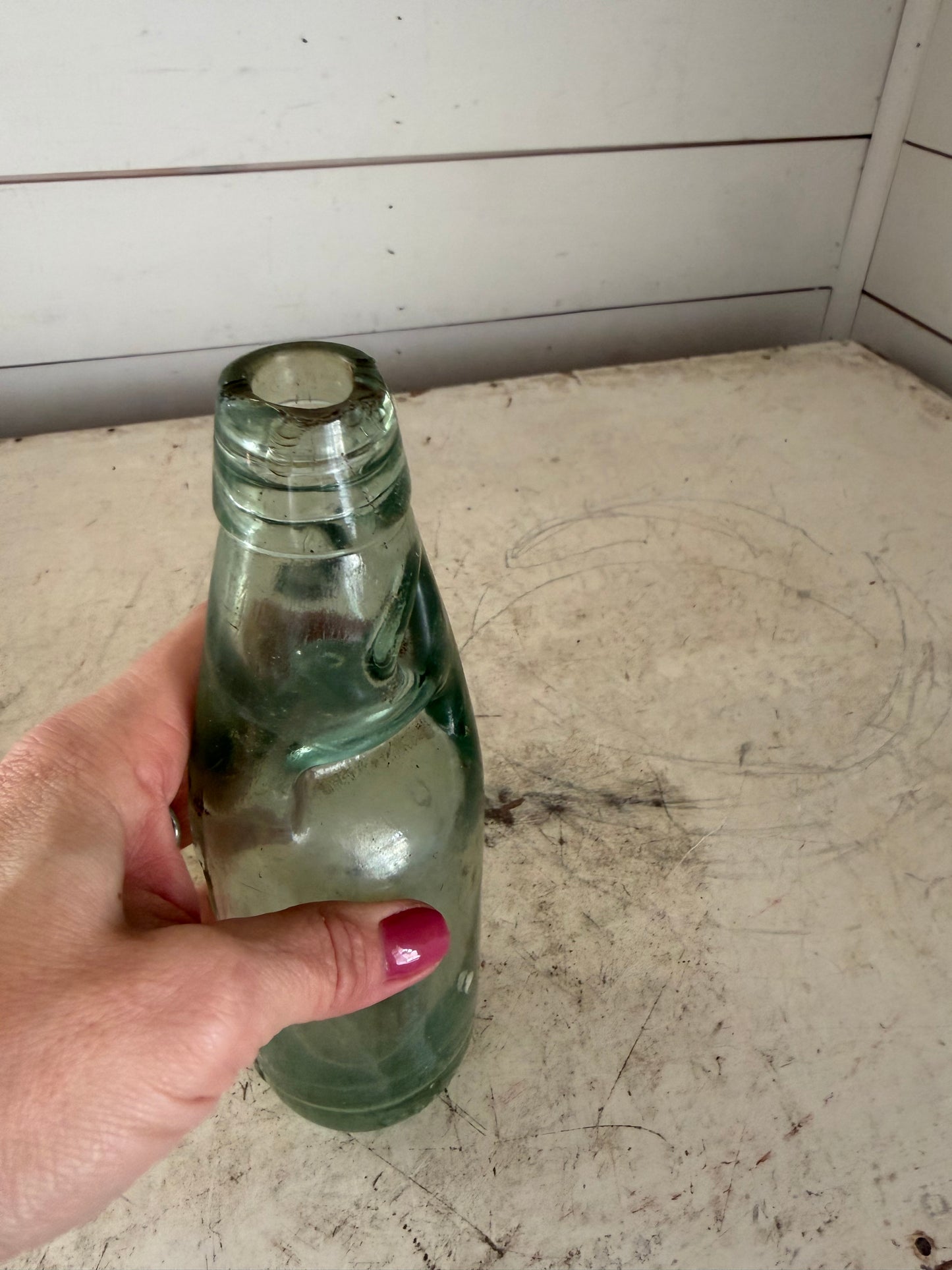 Antique glass Codd soda bottle