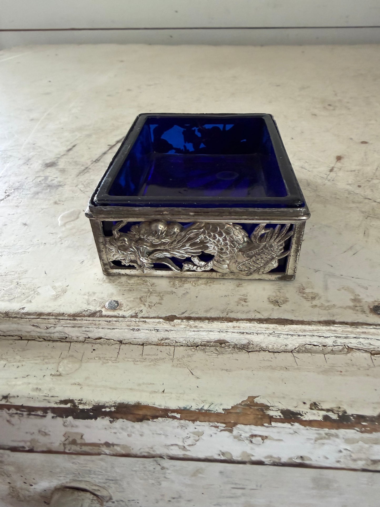 Vintage dragon themed trinket holder with cobalt blue glass insert