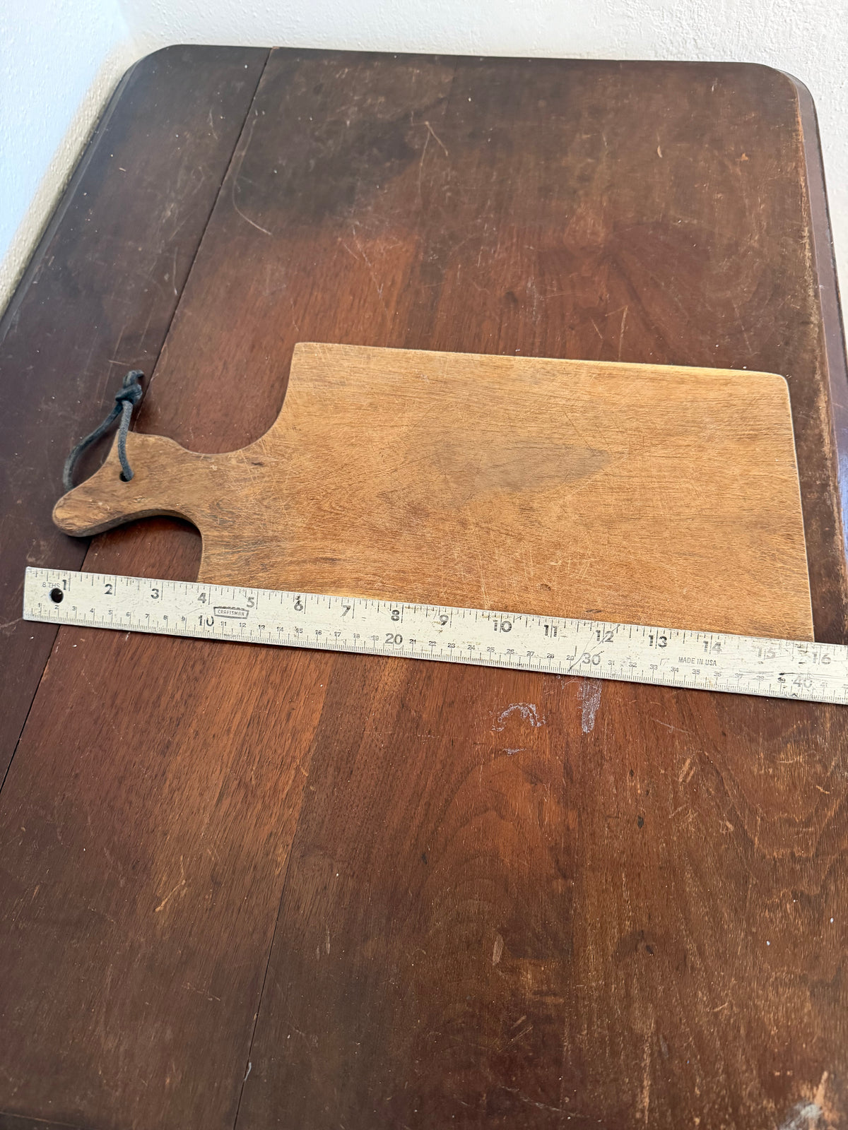 Rectangle hand, cut cutting board with leather strap