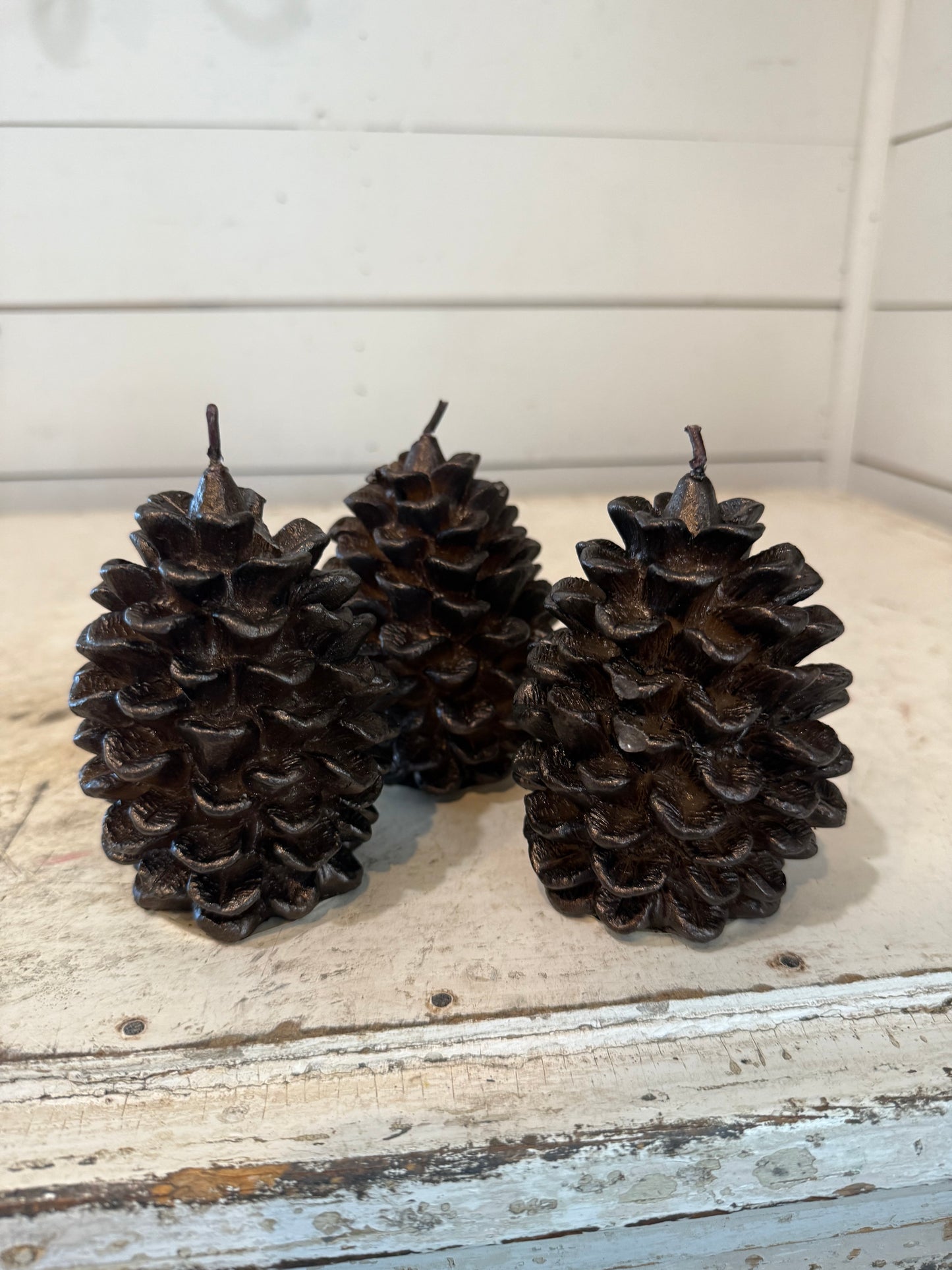 Pottery Barn brown metallic pinecone candle - some of the pinecone petals may be loose in bag - sold individually