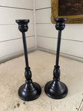 Set of black metal candlesticks