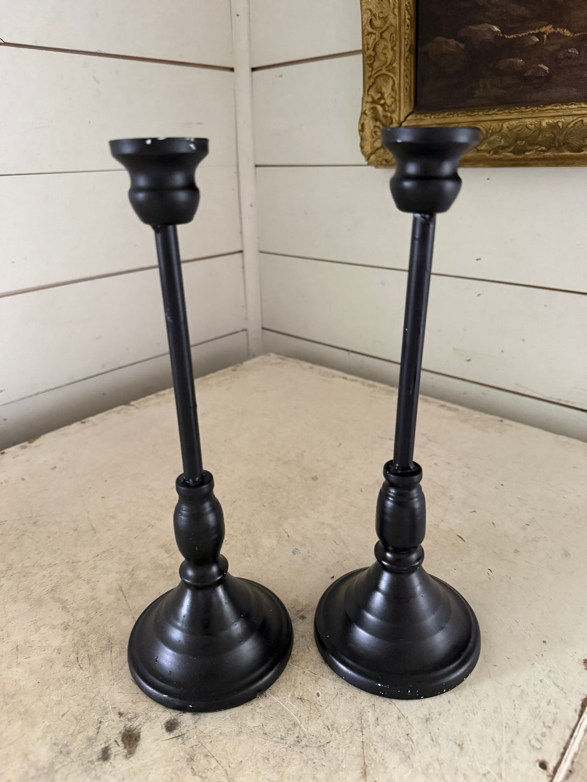Set of black metal candlesticks