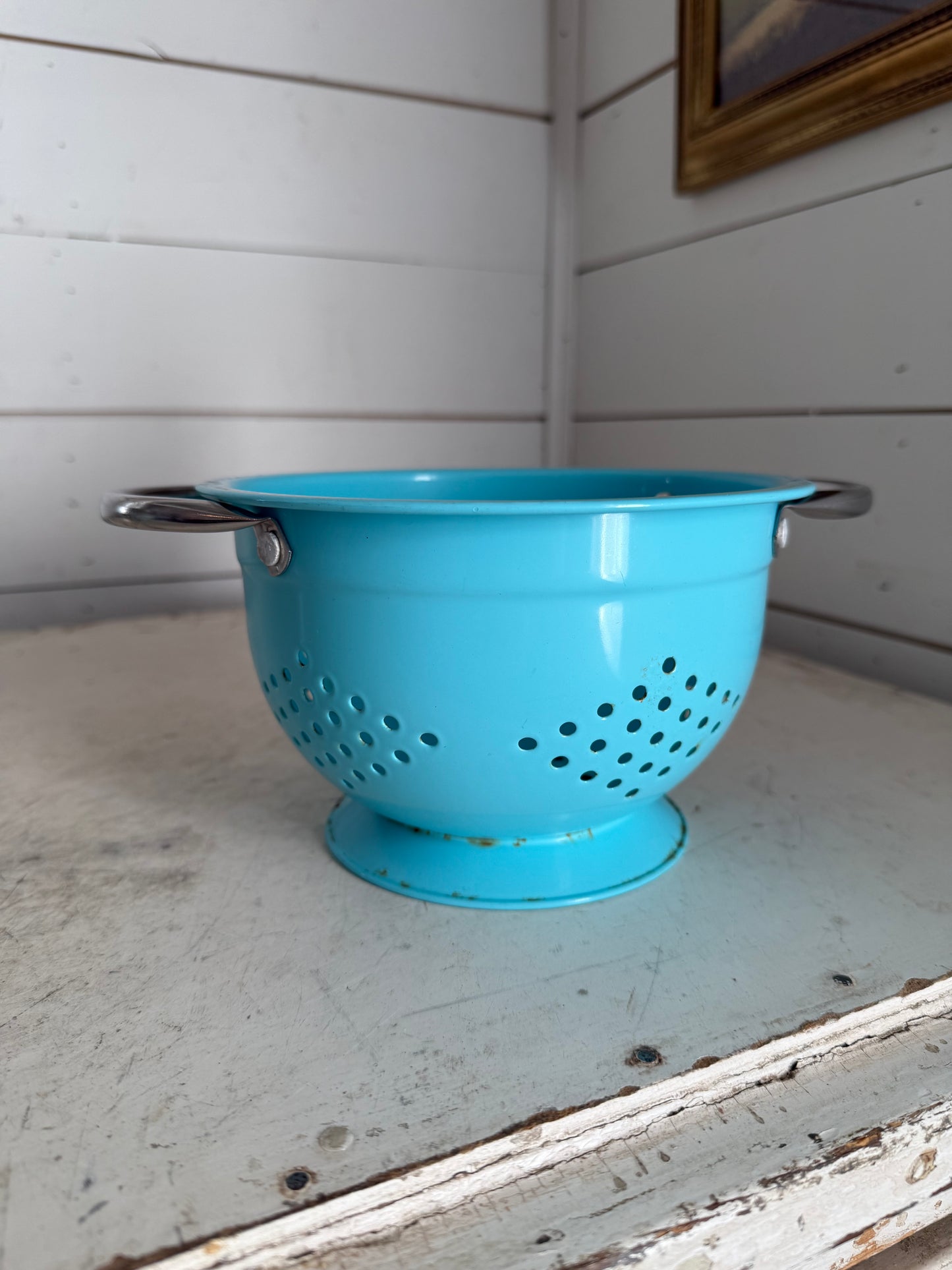 Medium teal colander with a little rust