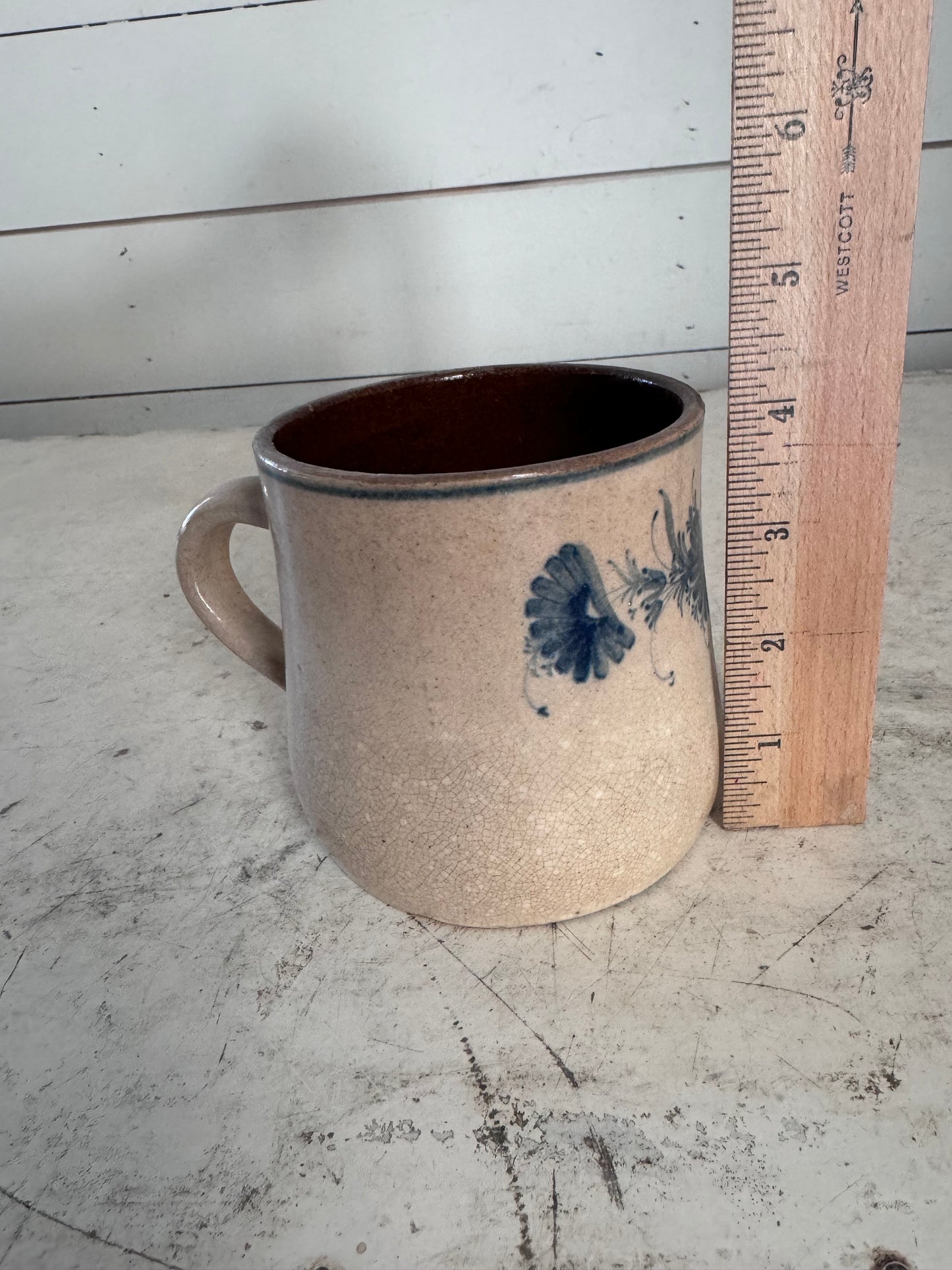 Antique blue floral print earthenware mug