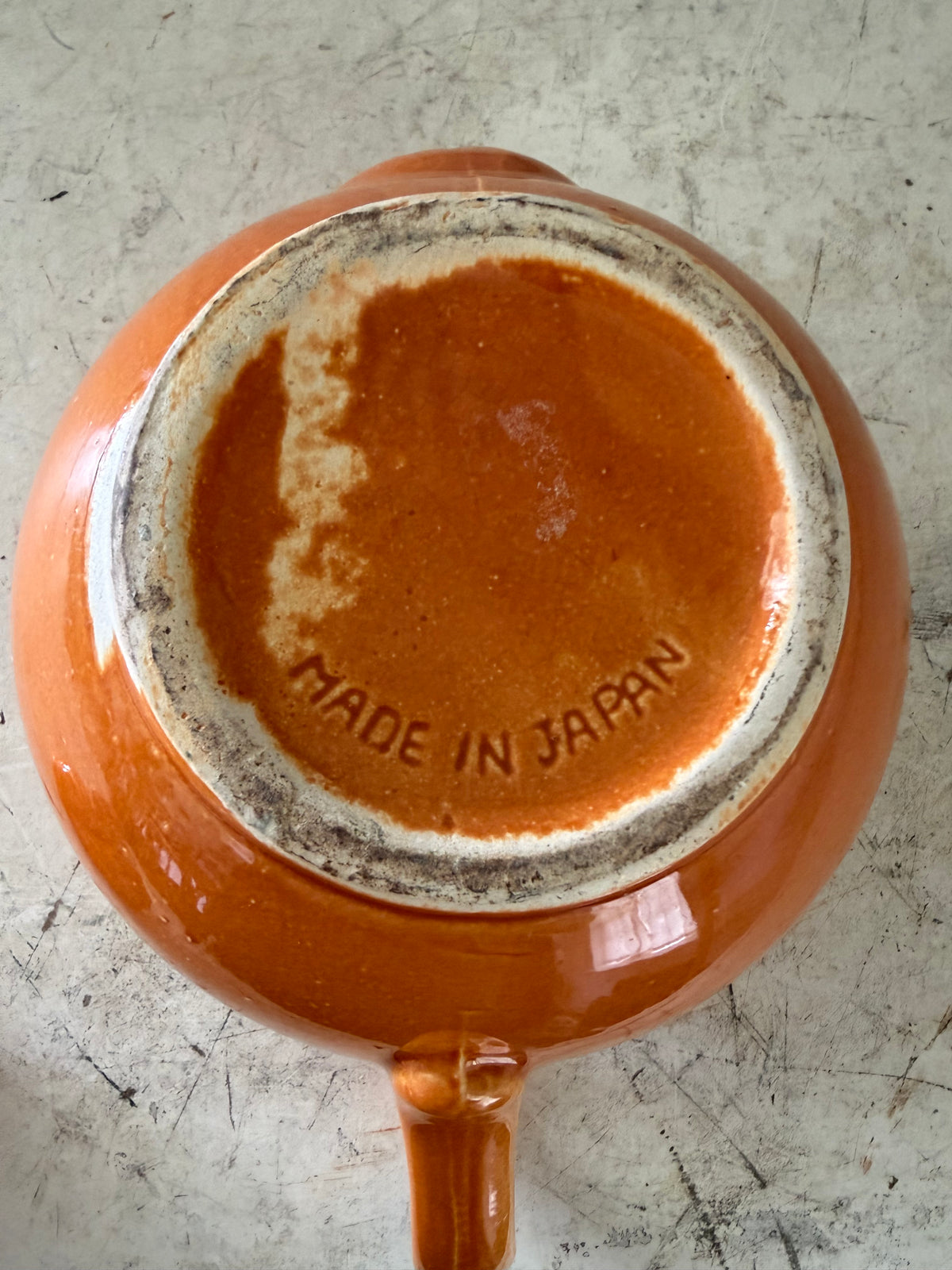 Ceramic orange glazed tea pot has some chip under lid - Madd in Japan