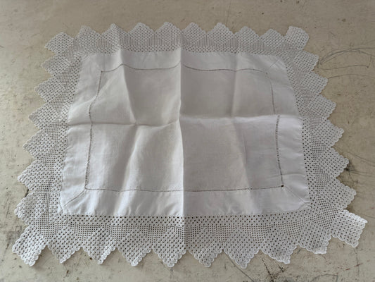 Vintage linen tray cloth or table topper with a wide crochet lace border.