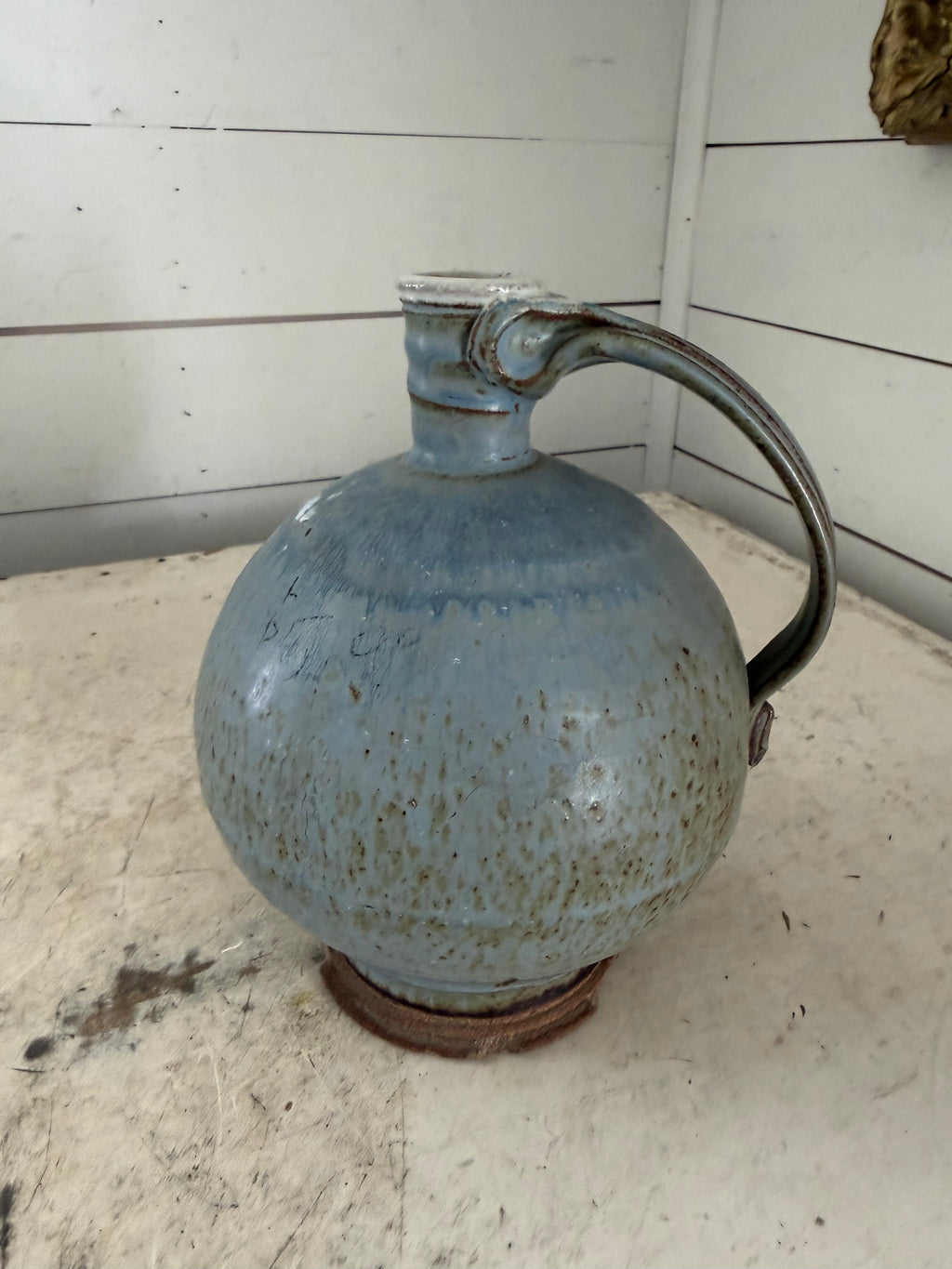 Vintage pottery studio jug has chips at base as shown