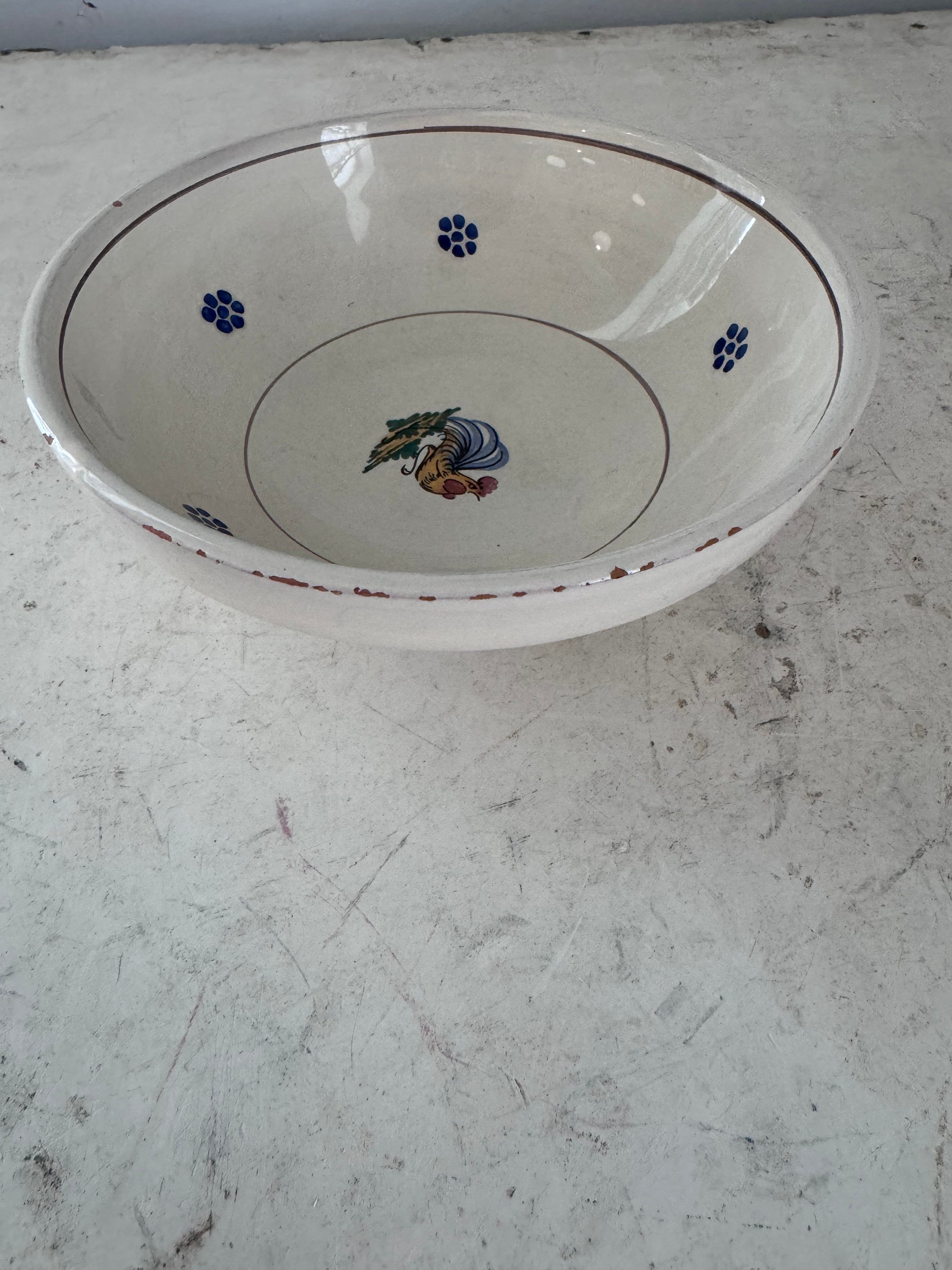 Small enameled terracotta bowl has chips - sold separately