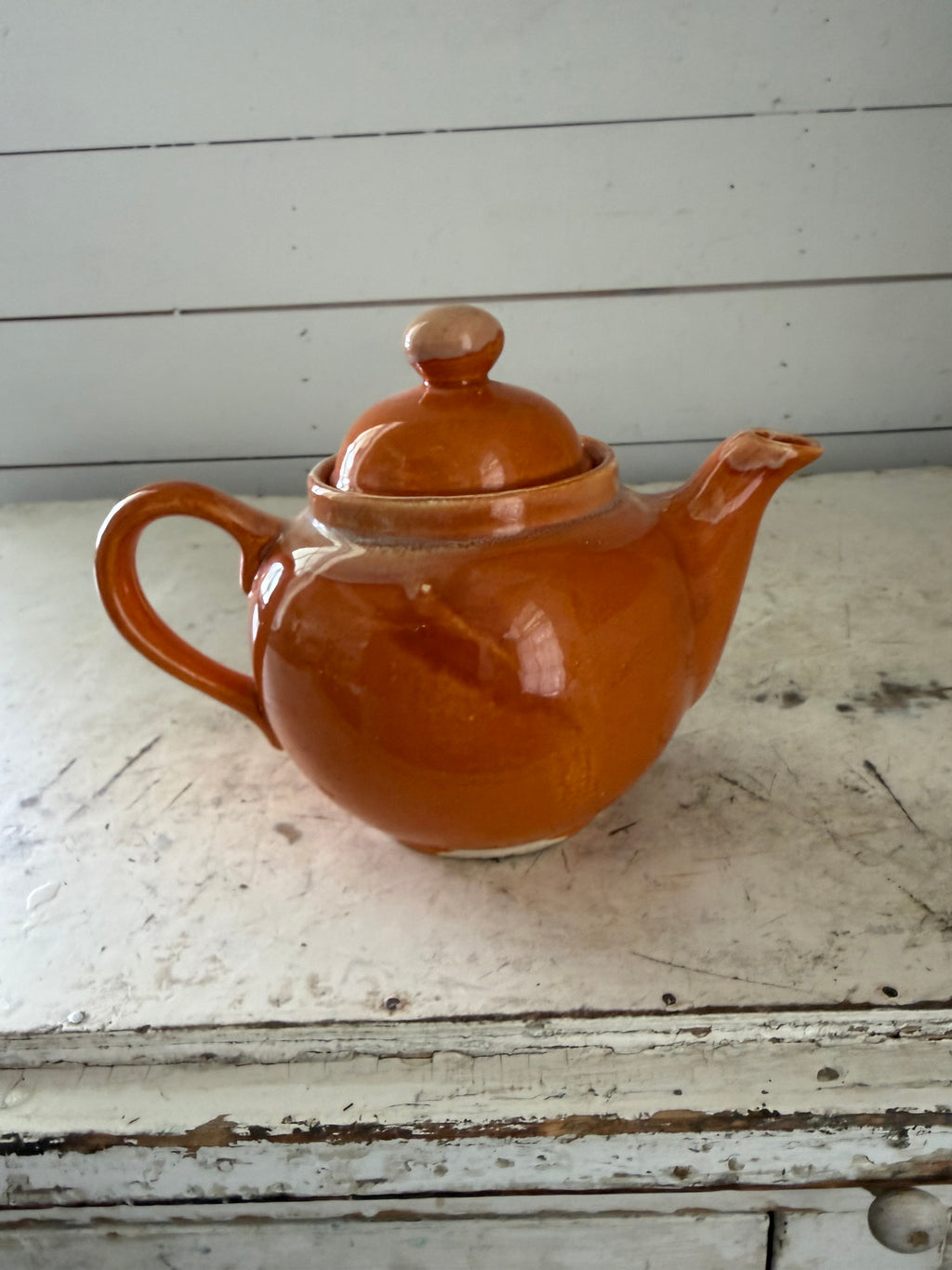 Ceramic orange glazed tea pot has some chip under lid - Madd in Japan