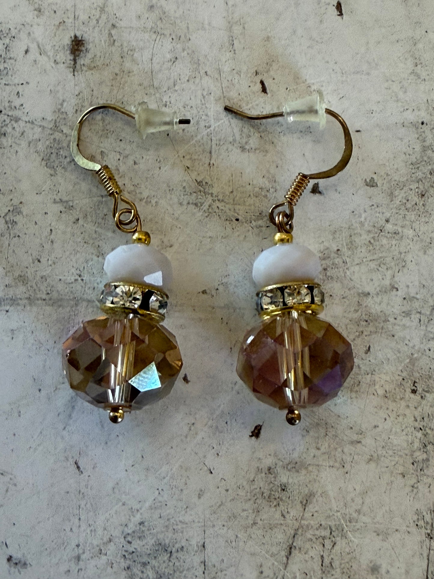 Vintage champagne bronze glass dangle earrings with an antique brass finish