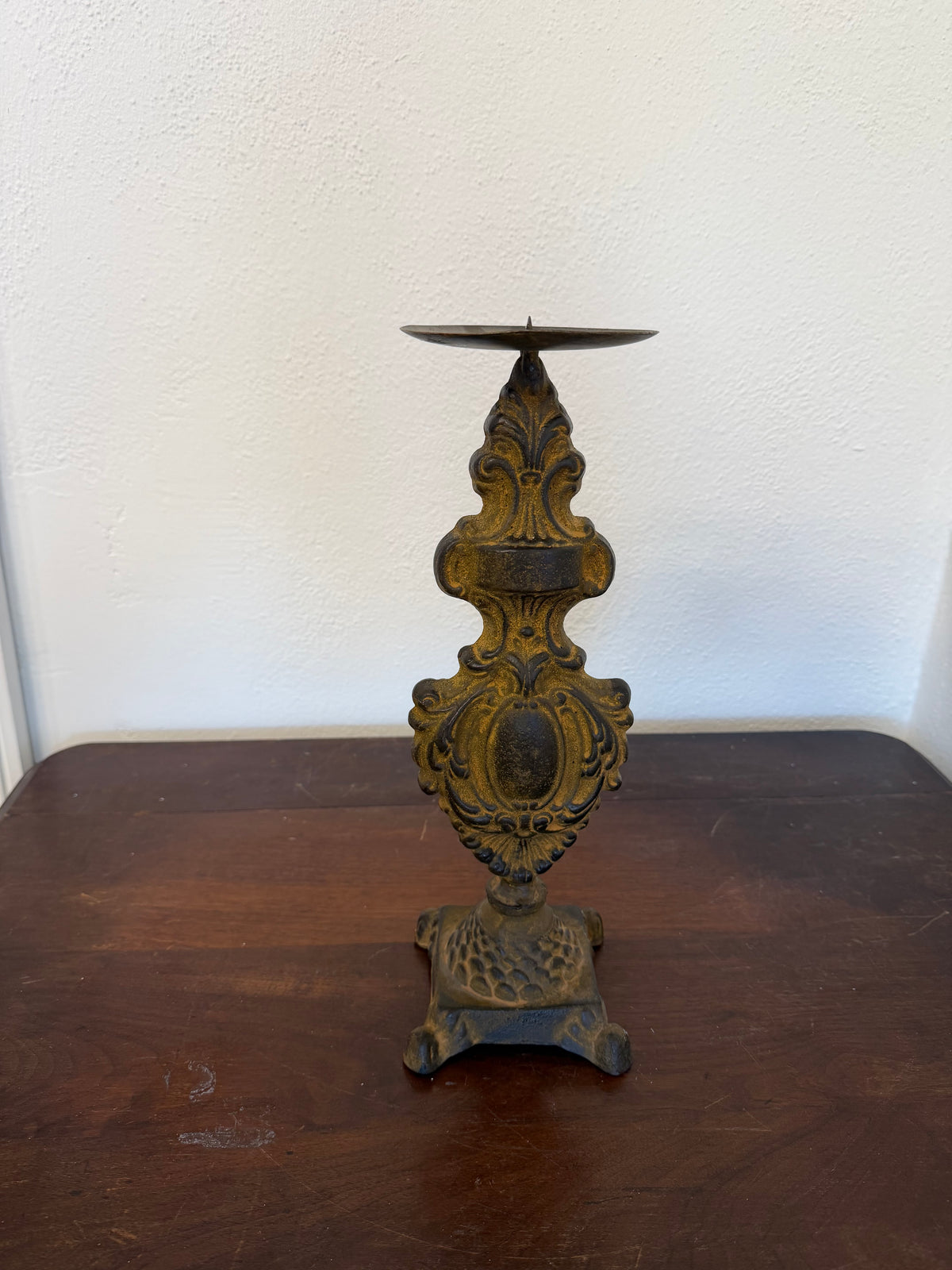Baroque-style cast iron candlestick holder