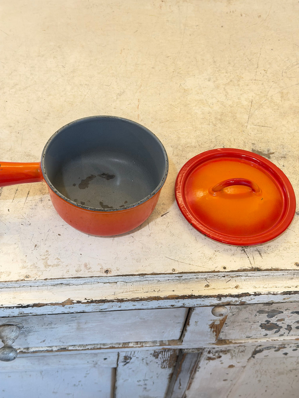 Vintage Descoware Orange Enamel Cast Iron Sauce Pan - has some chips in the enamel
