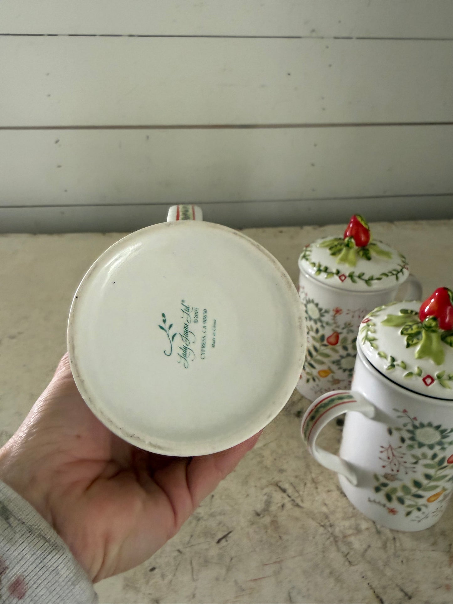 Lady Jayne Ltd. porcelain tea mugs with lids featuring a festive fruit and foliage pattern - sold individually ￼