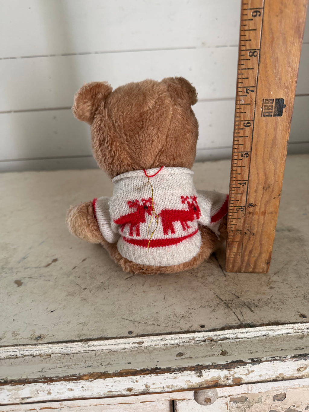 Vintage teddy bear with reindeer sweater