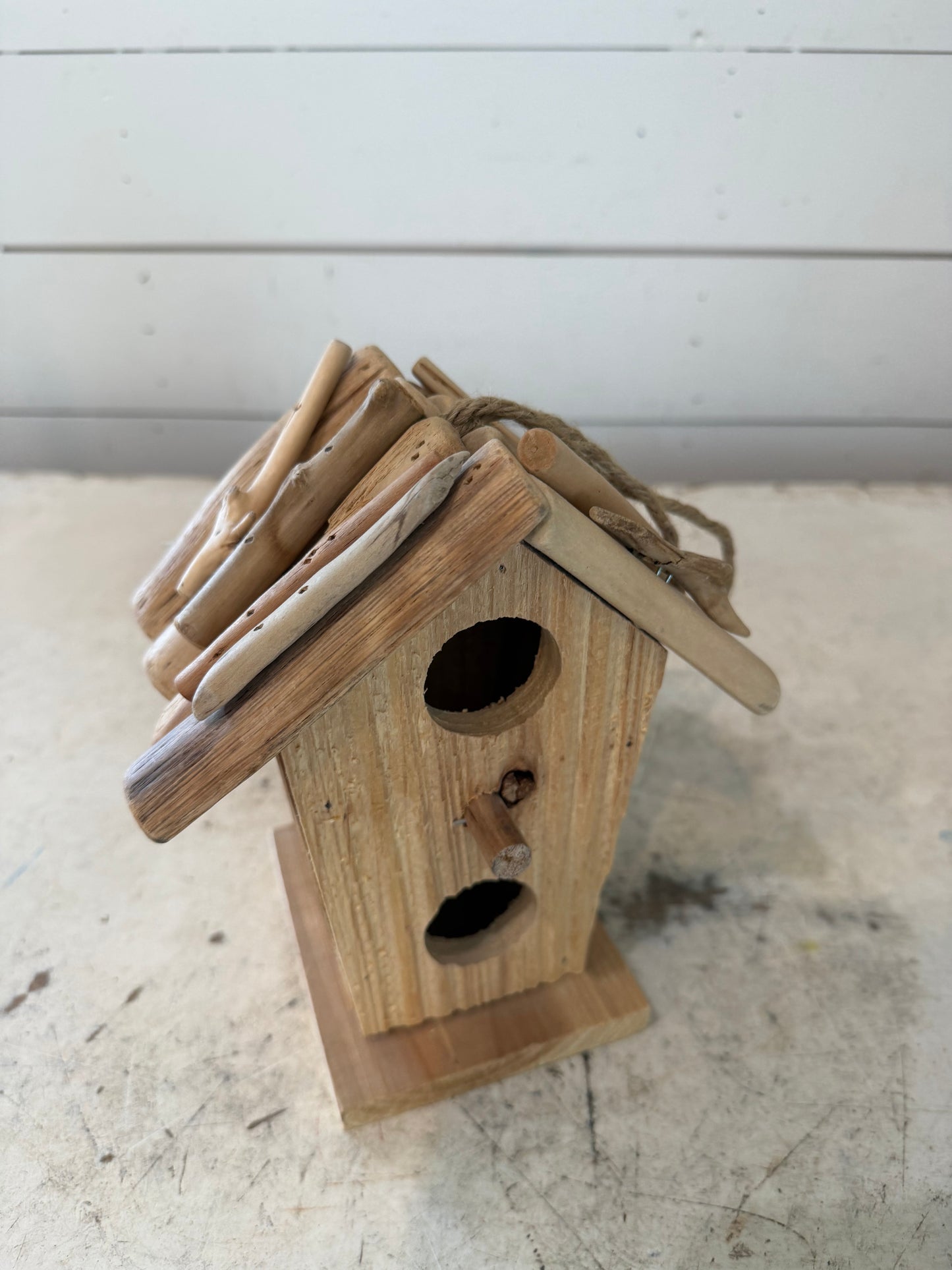 Rustic birdhouse with driftwood roof will get makeover