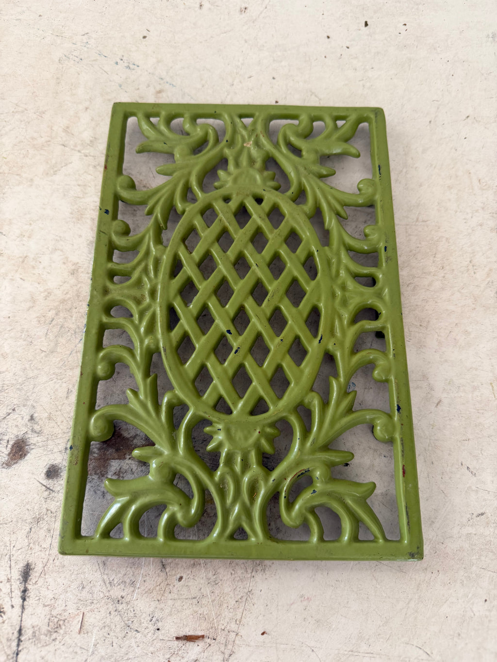 Green cast-iron trivet