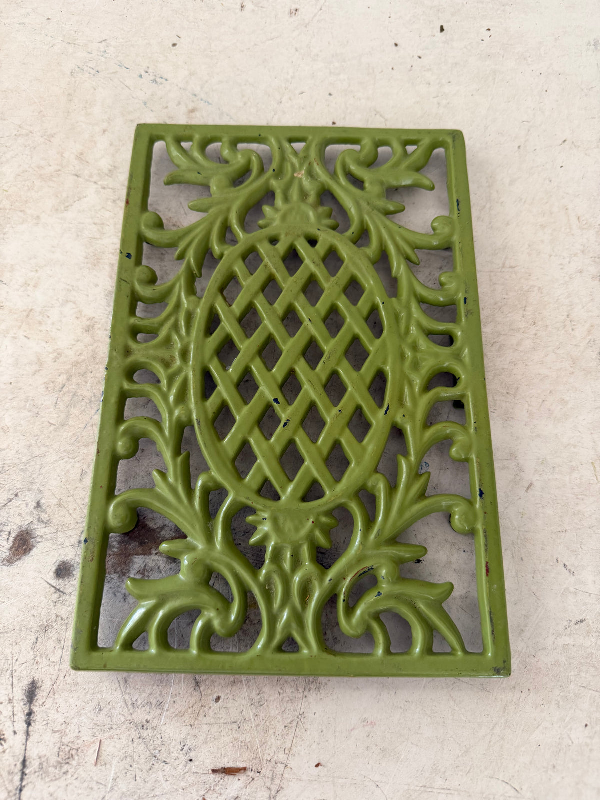 Green cast-iron trivet