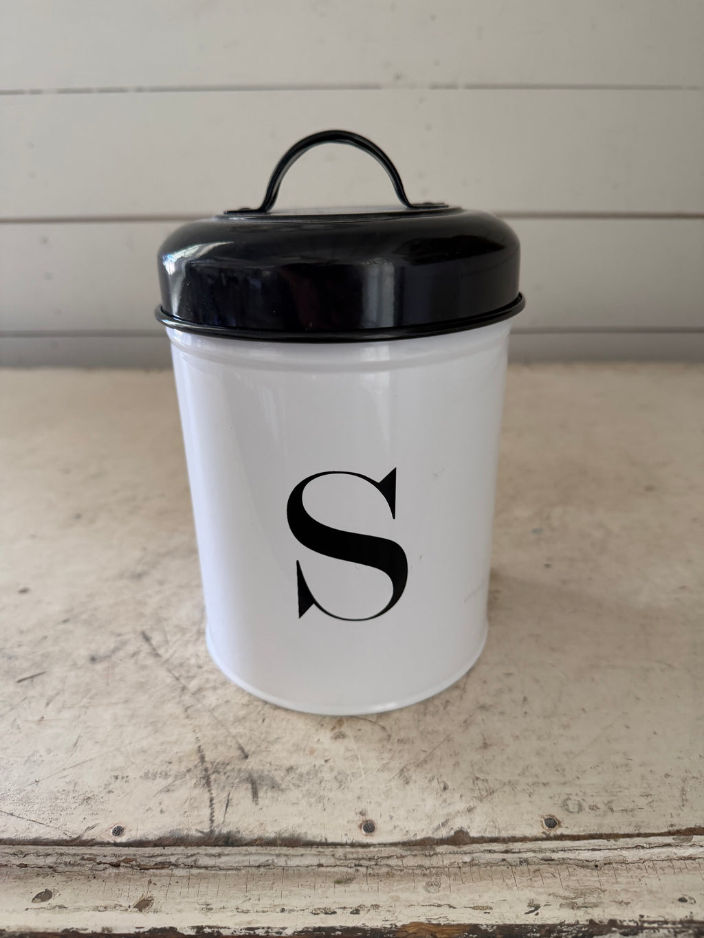Metal enamel canister with an S on it will get makeover