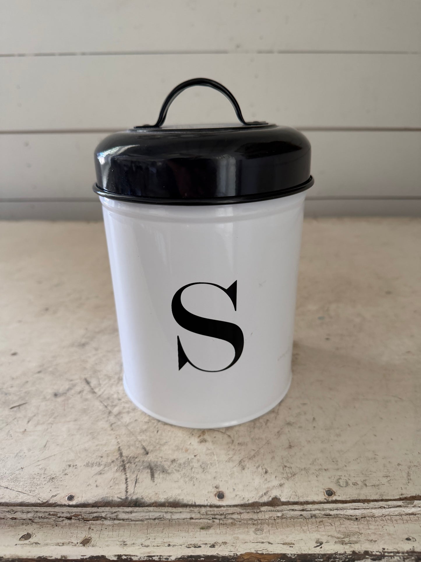 Metal enamel canister with an S on it will get makeover