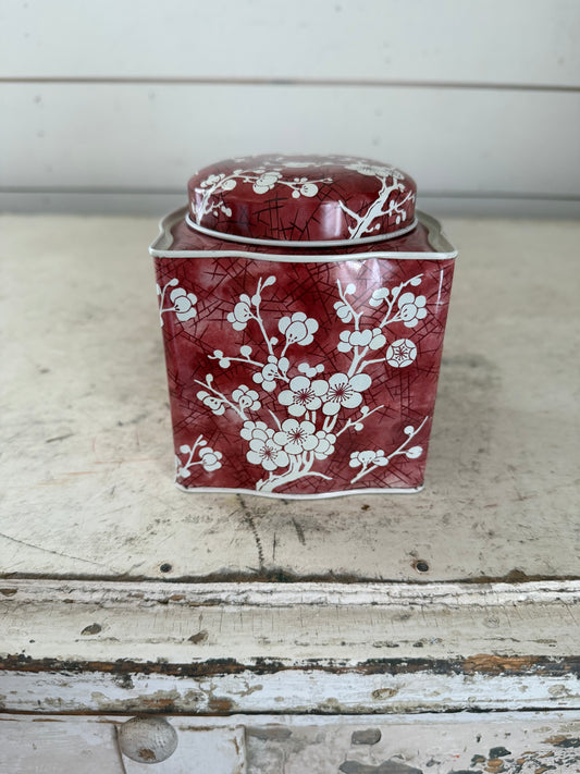 Daher decorated tin with a red and white cherry blossom pattern