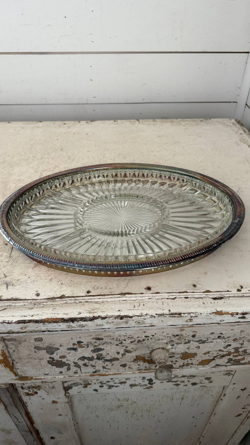 silver-plated relish tray features a removable divided crystal insert with a radiating pattern.