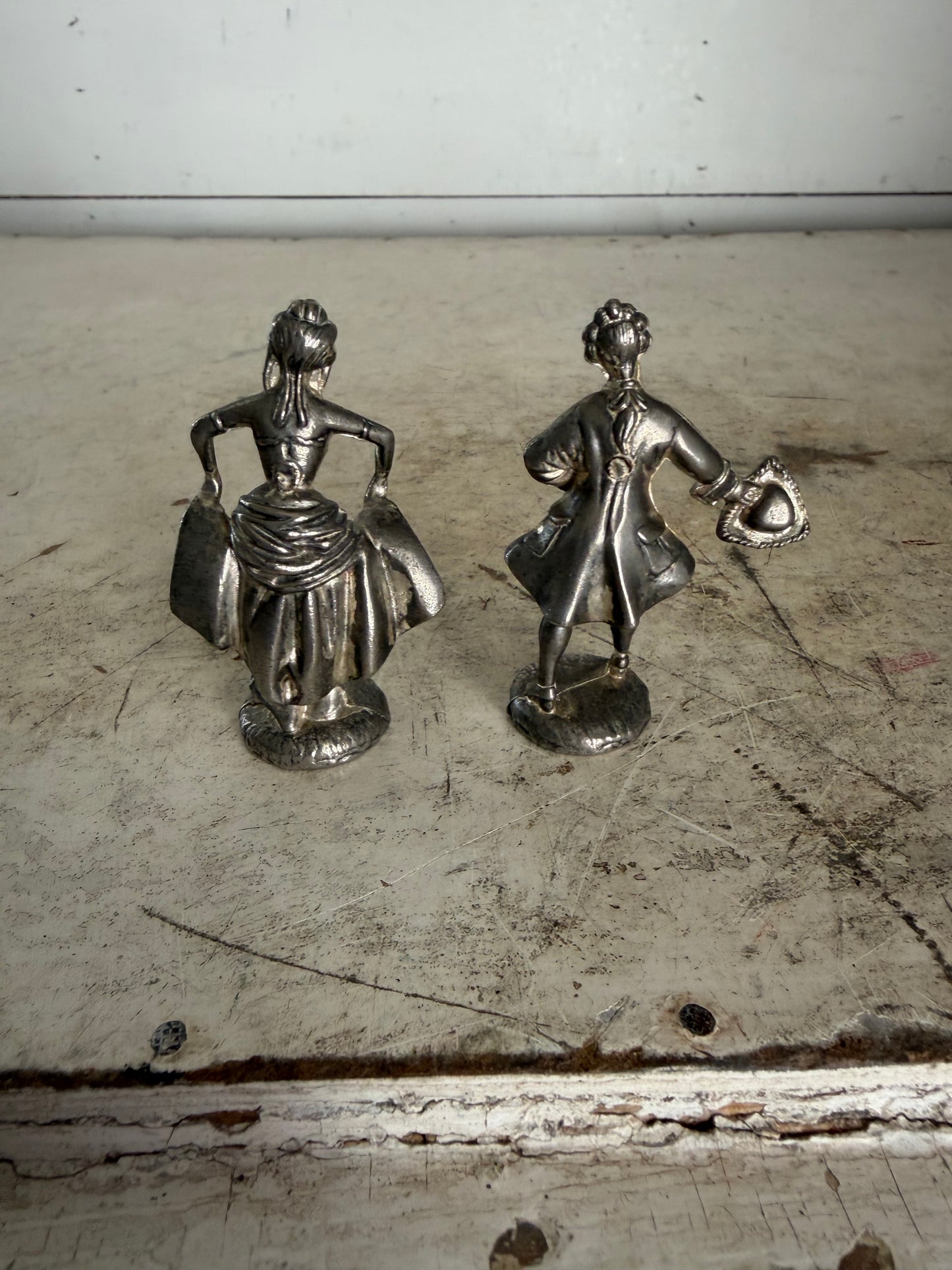 Pair of vintage pewter figurines depicting a courting lady and gentleman