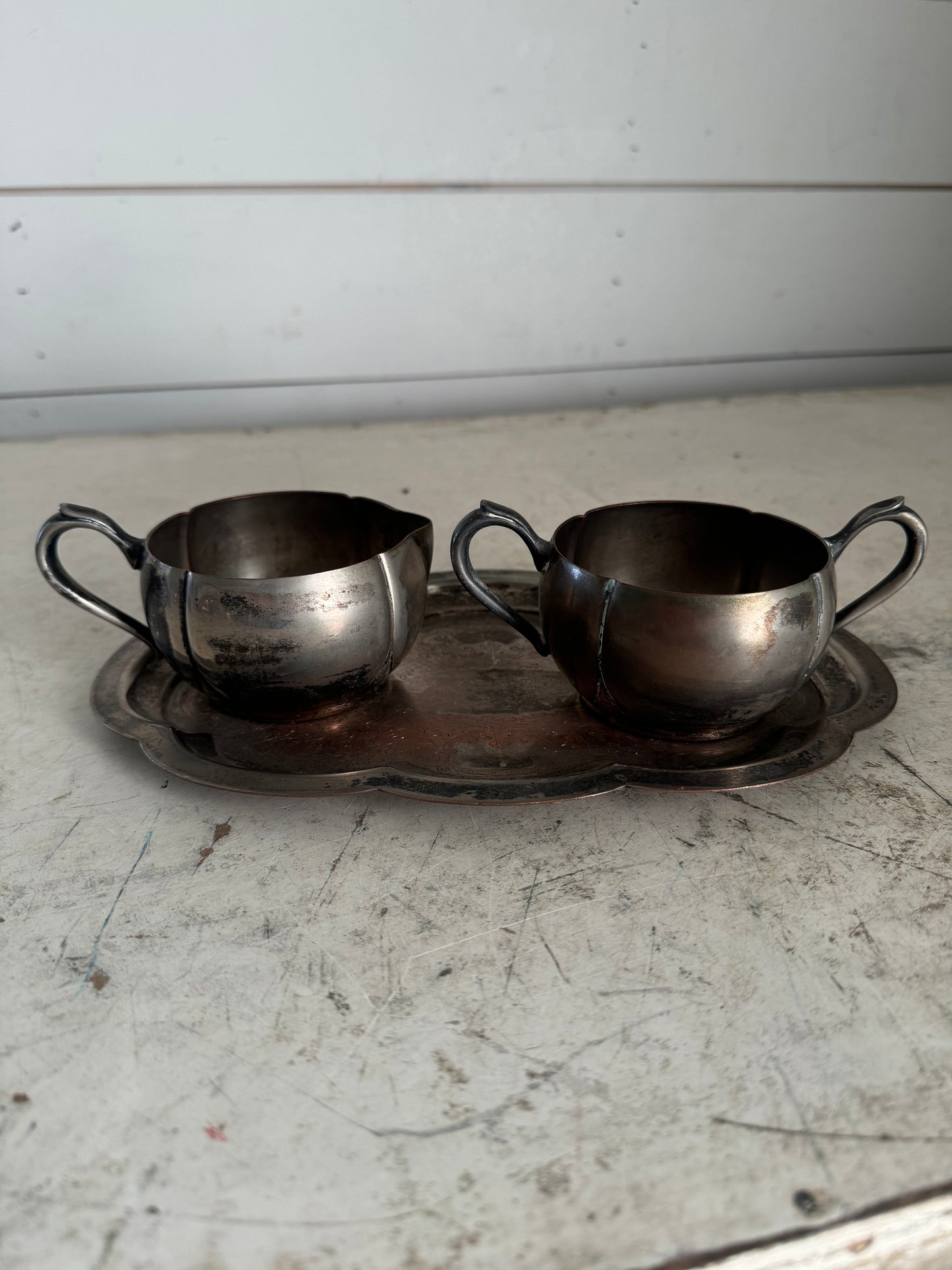 Silver creamer and sugar with small platter